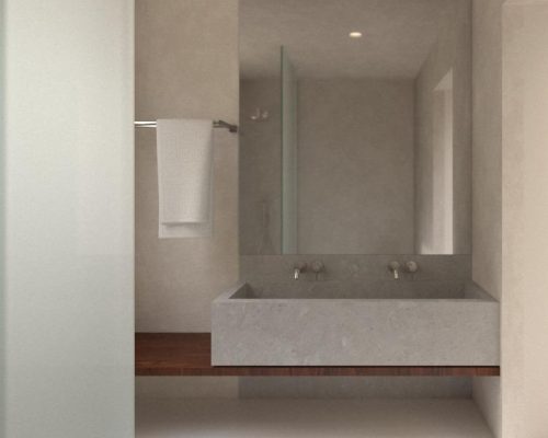 Baño moderno en vivienda de obra nueva con lavamanos de hormigón pulido