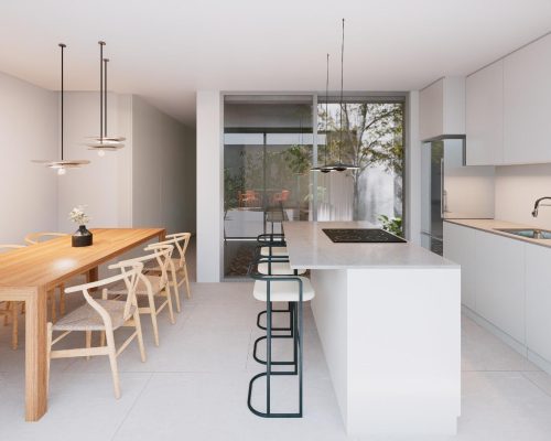 Comedor moderno con cocina en vivienda de diseño contemporánea construida en Valencia